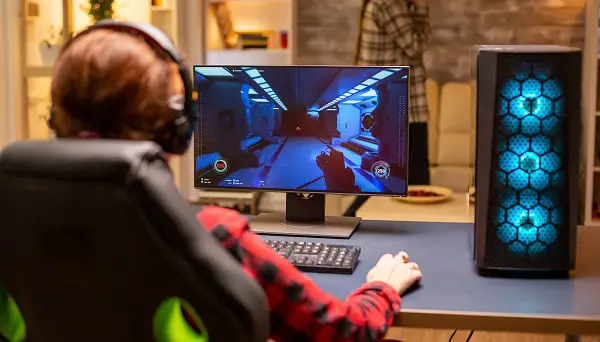 Player watching addicting game on screen